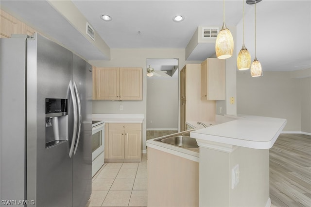 kitchen featuring light brown cabinets, ceiling fan, light hardwood / wood-style flooring, sink, and stainless steel fridge with ice dispenser