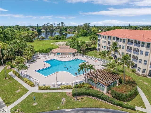 view of swimming pool with a gazebo, a lawn, a water view, and a patio area