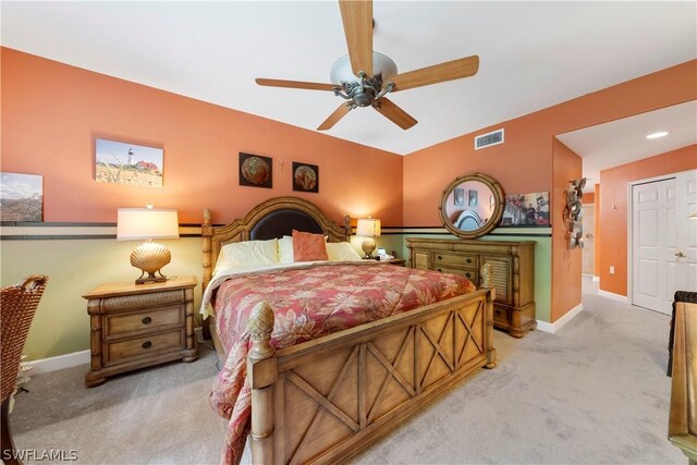 bedroom with ceiling fan and light colored carpet