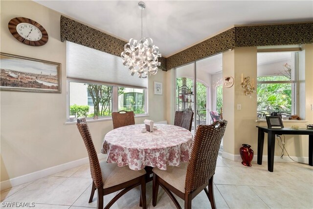 tiled dining area featuring a notable chandelier