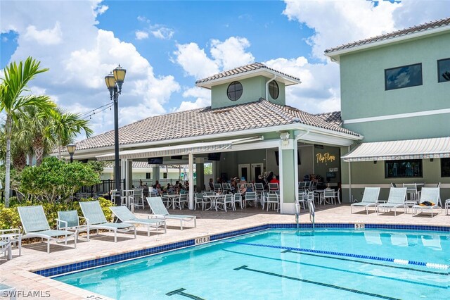 view of swimming pool featuring a patio area