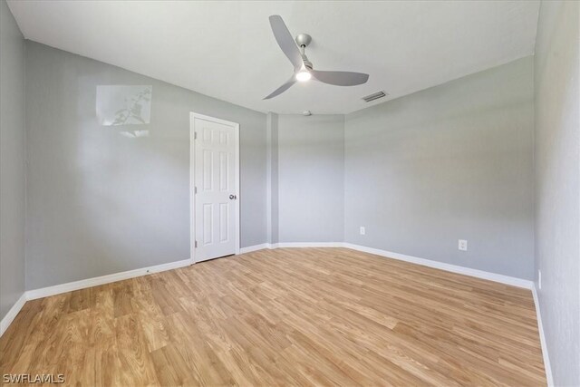 spare room with light hardwood / wood-style floors and ceiling fan