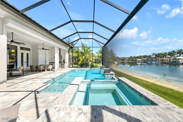 view of pool with french doors, a pool with connected hot tub, a water view, glass enclosure, and ceiling fan