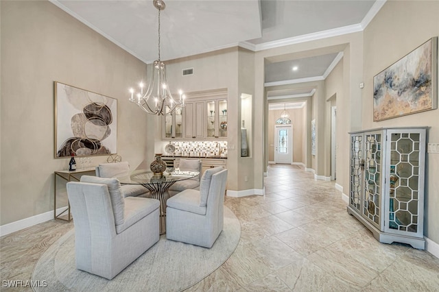 dining space featuring sink, crown molding, and an inviting chandelier