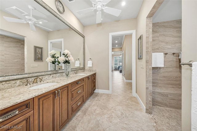 full bath with a ceiling fan, walk in shower, a sink, and double vanity