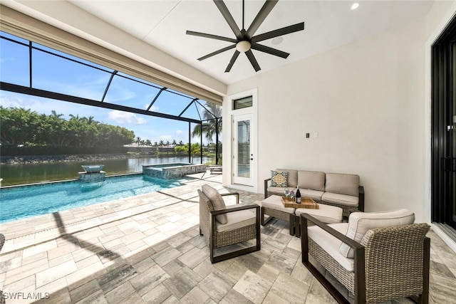 sunroom / solarium featuring a water view and a ceiling fan