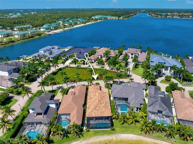 birds eye view of property featuring a residential view and a water view