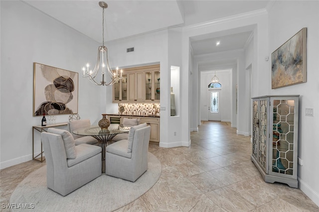 dining room with baseboards, ornamental molding, visible vents, and a notable chandelier