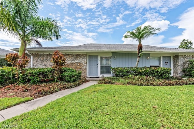 ranch-style house with a front lawn