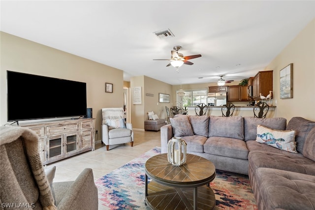 living room with ceiling fan and light tile patterned floors