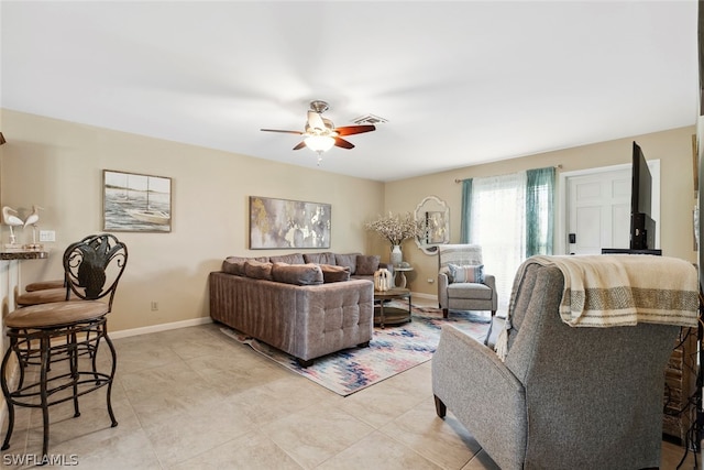 living room featuring ceiling fan