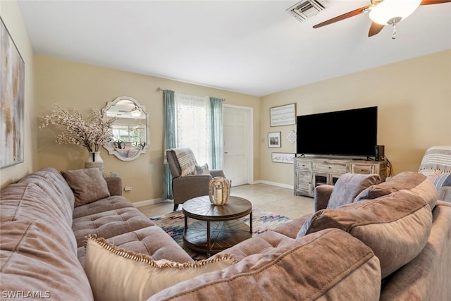 tiled living room with ceiling fan