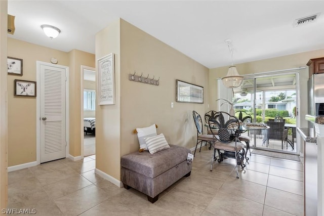 living area featuring light tile patterned floors