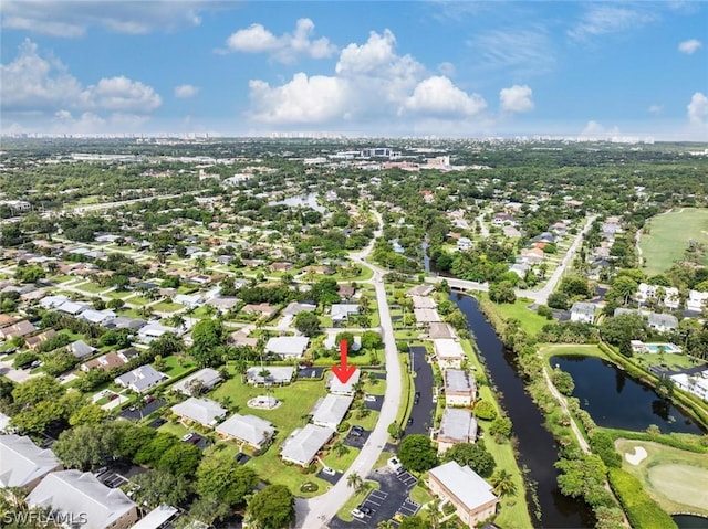 birds eye view of property with a residential view and a water view