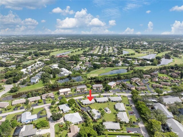 birds eye view of property with a residential view and a water view