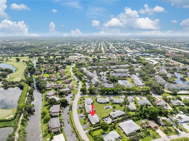 bird's eye view featuring a residential view, view of golf course, and a water view