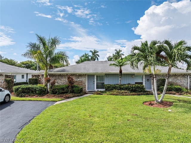 ranch-style home with a front yard