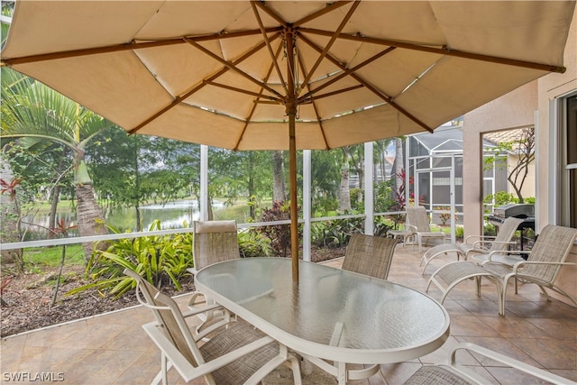 unfurnished sunroom with vaulted ceiling and a water view