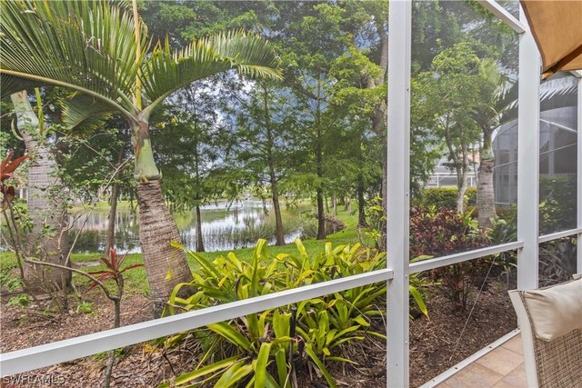 unfurnished sunroom with a water view