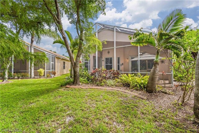 view of yard with a lanai