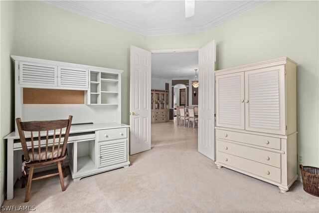 carpeted home office featuring crown molding