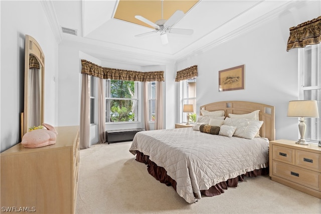 carpeted bedroom featuring crown molding and ceiling fan