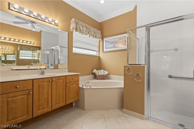 bathroom with plus walk in shower, ceiling fan, ornamental molding, and vanity