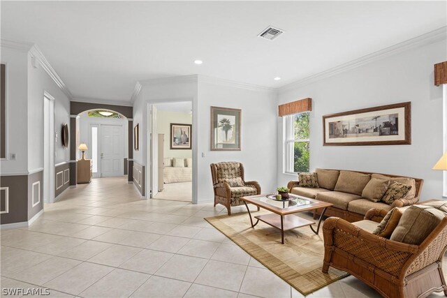 tiled living room featuring ornamental molding