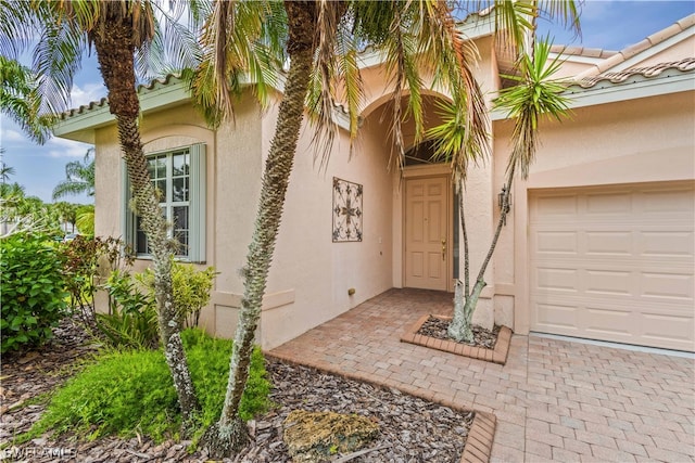 entrance to property featuring a garage