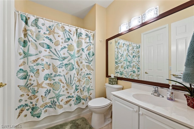 bathroom with vanity, tile patterned floors, and toilet