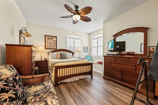 bedroom featuring hardwood / wood-style floors and ceiling fan