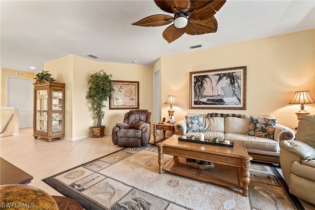 living room with light tile patterned flooring and ceiling fan