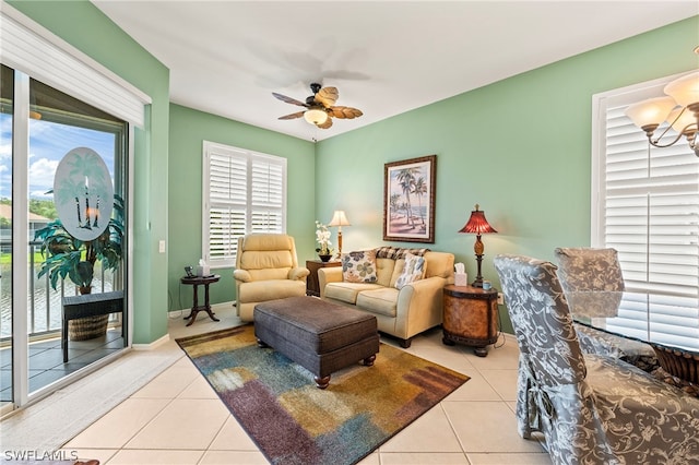 tiled living room with ceiling fan