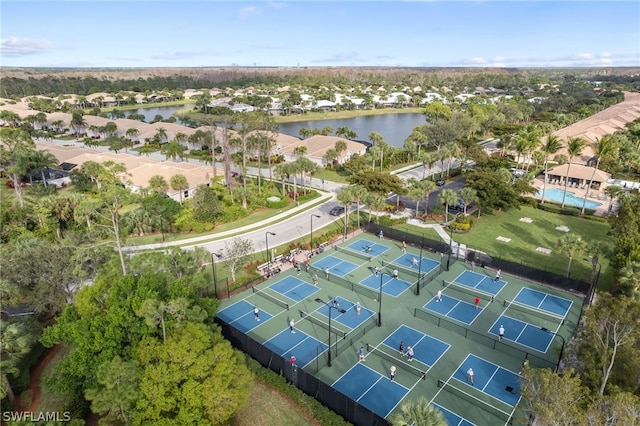 birds eye view of property with a water view