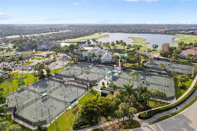 birds eye view of property with a water view