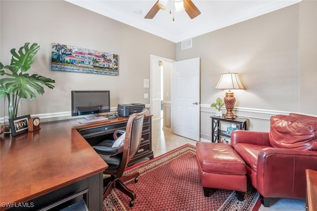 tiled office space featuring ceiling fan and ornamental molding