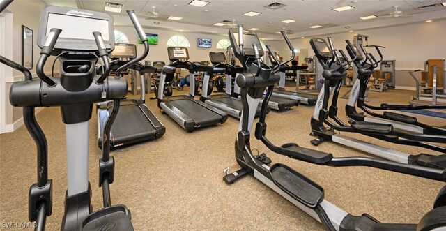 workout area featuring carpet flooring and ceiling fan