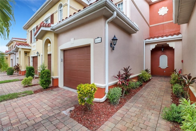 mediterranean / spanish-style house featuring a garage