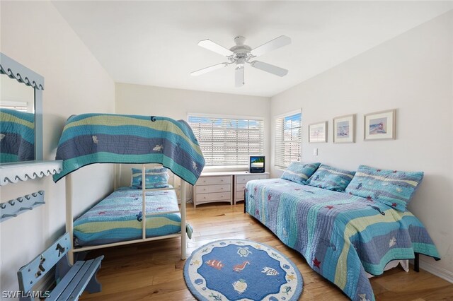 bedroom with wood finished floors and a ceiling fan