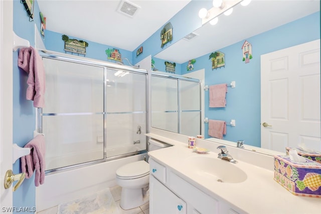 full bathroom featuring toilet, visible vents, combined bath / shower with glass door, and vanity