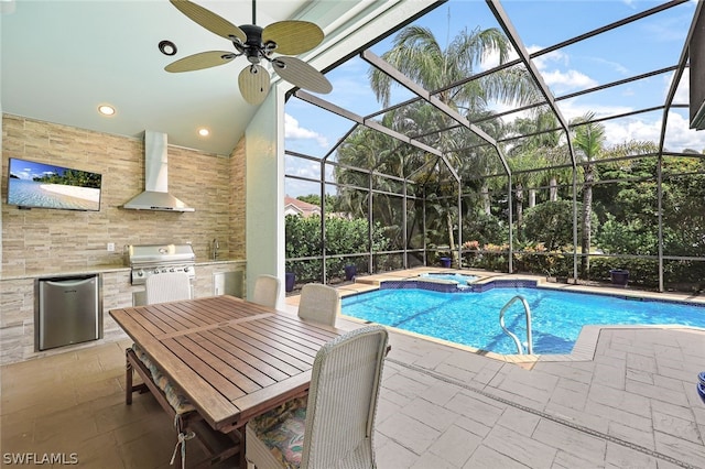 view of pool featuring an in ground hot tub, a lanai, an outdoor kitchen, a grill, and a patio area