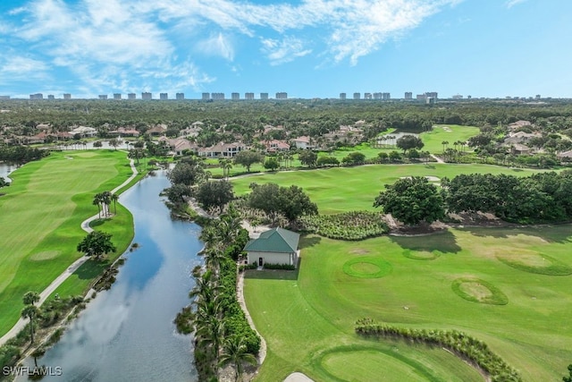 birds eye view of property featuring view of golf course, a water view, and a city view