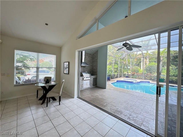 view of pool with area for grilling and a pool with connected hot tub