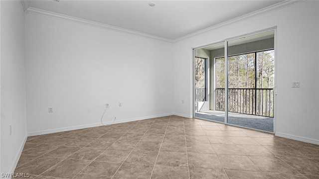 empty room featuring crown molding and light tile patterned flooring