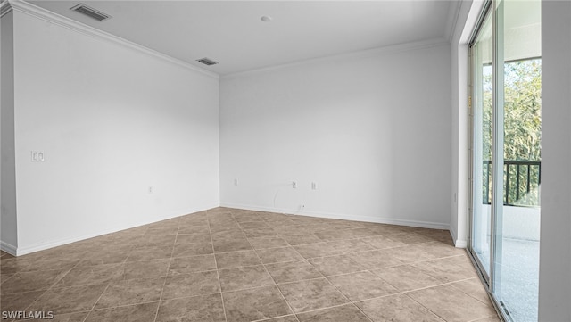 tiled spare room with crown molding and plenty of natural light