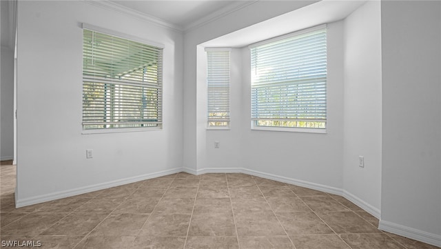 tiled empty room with crown molding