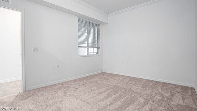 unfurnished room with light carpet and ornamental molding