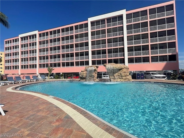 view of swimming pool featuring pool water feature