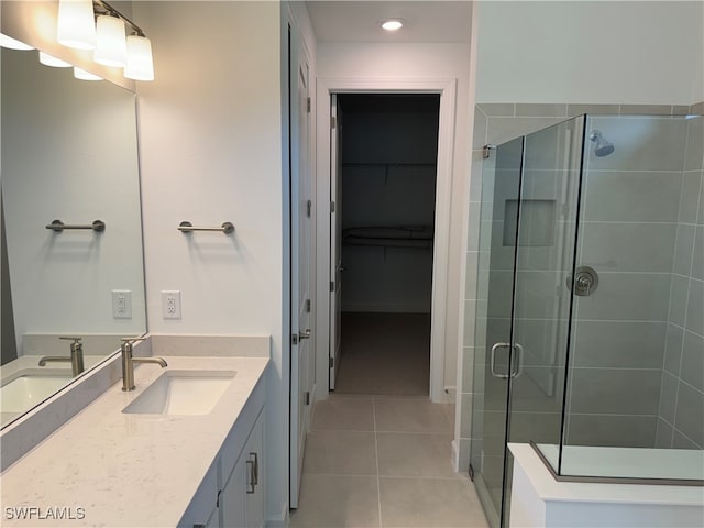 bathroom with vanity, tile patterned floors, and walk in shower