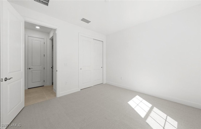 17161 Oakstead Dr, Alva, FL 33920 - unfurnished bedroom featuring carpet flooring, baseboards, and visible vents